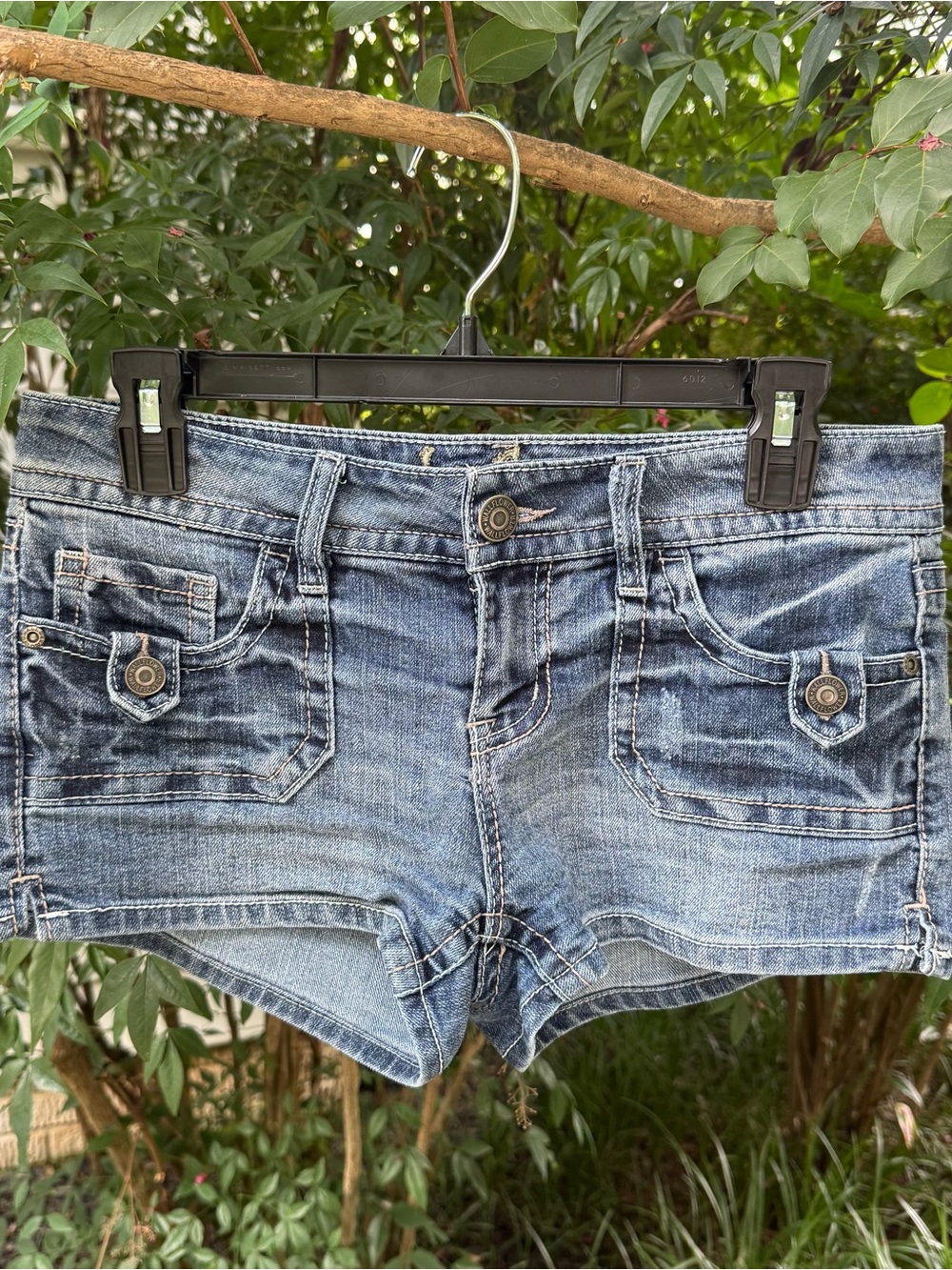low rise blue denim shorts with cute details